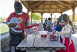 Residents Work Around a Table Building Birdhouses 1