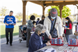 Woman Assisting an Elder with Her Birdhouse Project 1
