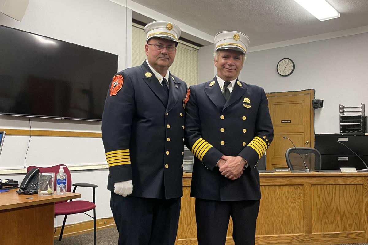 Two Officers Take a Group Photo Together 1