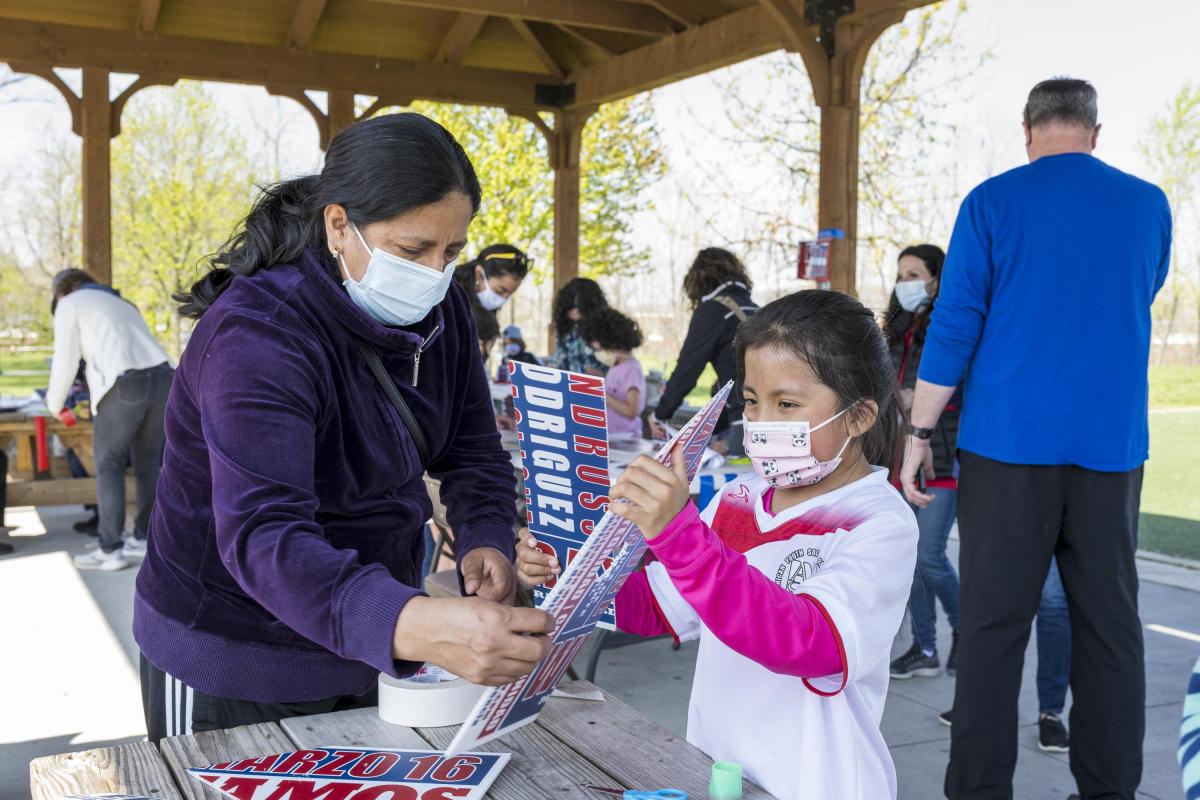 Mother Helping Daughter Make a Birdhouse 1
