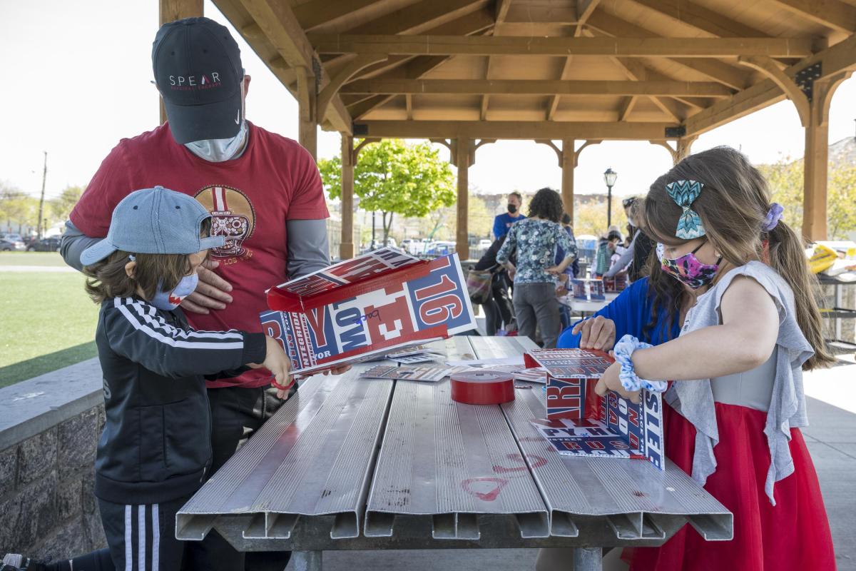 Residents Work Around a Table Building Birdhouses 1