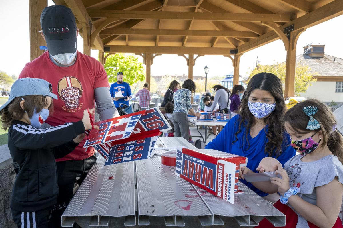 Residents Work Around a Table Building Birdhouses 2
