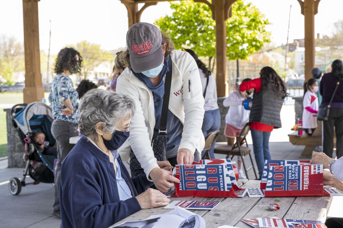 Woman Assisting an Elder with Her Birdhouse Project 2